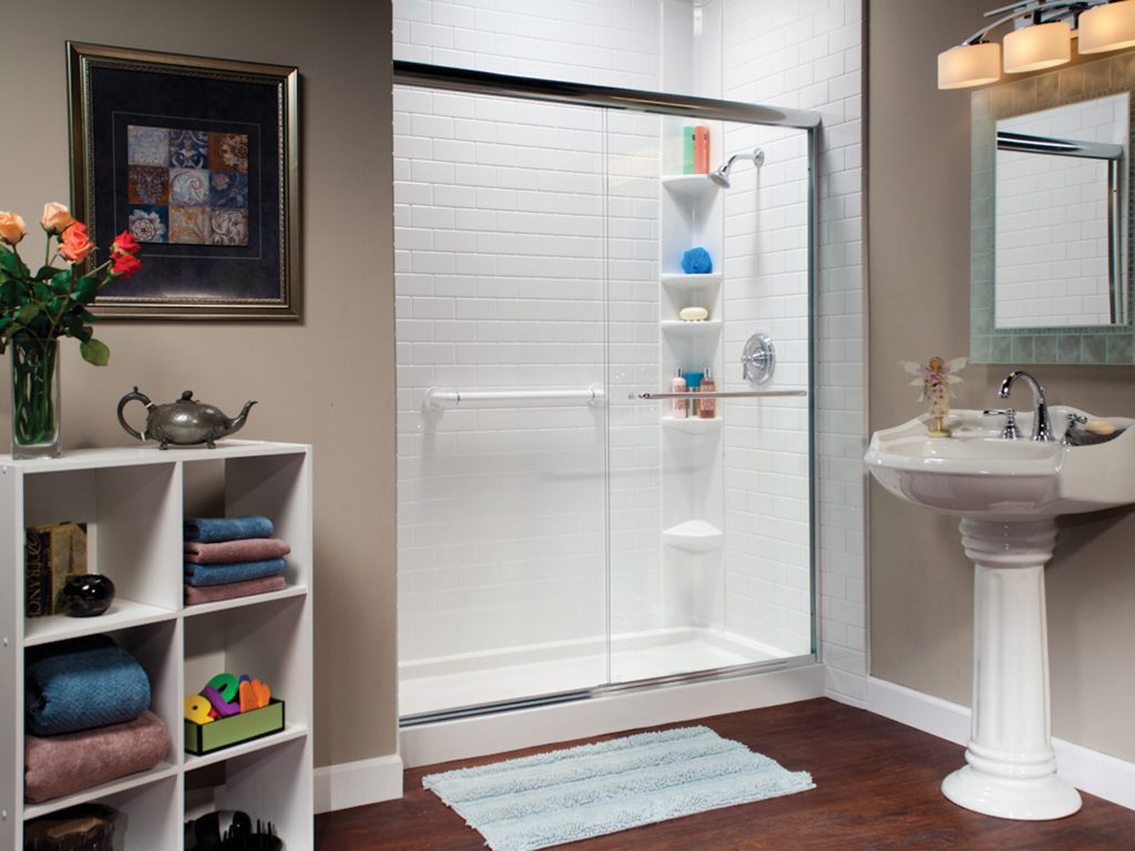 Modern bathroom with white subway tiles shower enclosure.