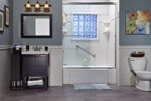 A modern bathroom with blue walls and white fixtures perfect for a one day bath remodel.