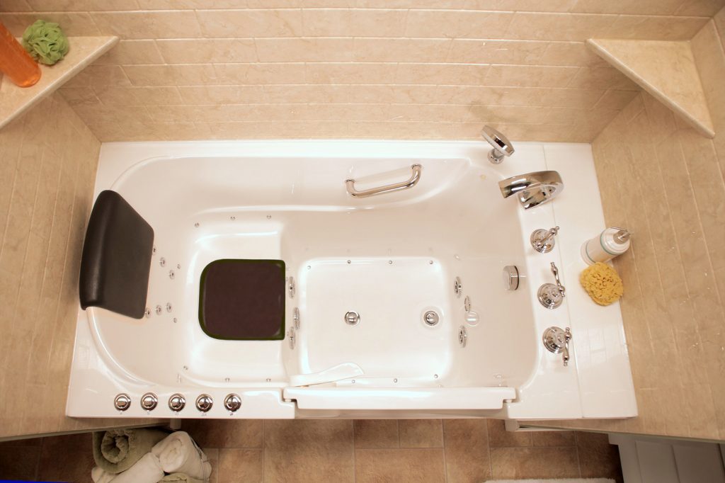 Bathtub with seat and grab bars for elderly.