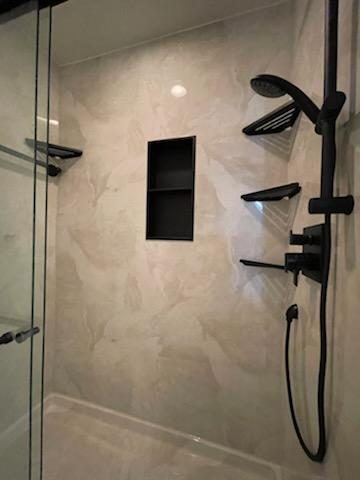 Black shower niche and fixtures.