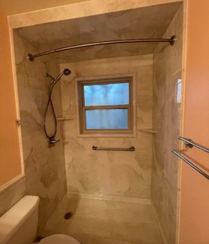 Small bathroom with shower and toilet.